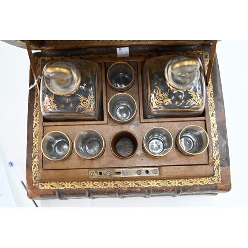 541 - A French liqueur set, the case formed from antique French gilt tooled leather bound books, with a pa... 