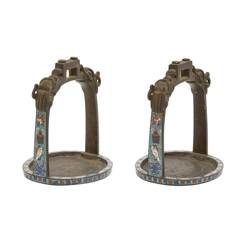 119 - A pair of Chinese champleve enamel bronze stirrups, Qing dynasty, c1900, chiselled with dragons, 16c... 