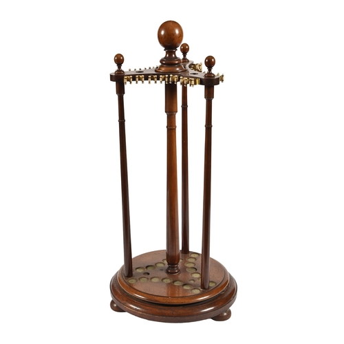 205 - Billiards and Snooker.  An Edwardian mahogany revolving cue stand,  with globe finials, on turned ba... 