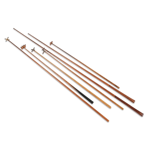 205 - Billiards and Snooker.  An Edwardian mahogany revolving cue stand,  with globe finials, on turned ba... 