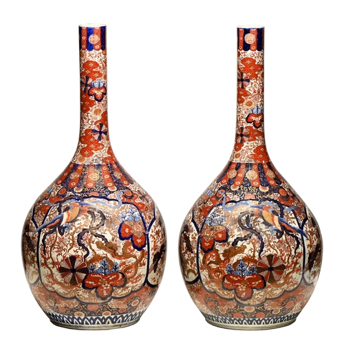 57 - A monumental pair of Japanese Imari vases, Meiji period, typically decorated and of bottle shape, 93... 