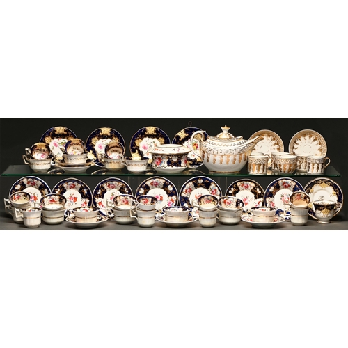 69 - A John Ridgway tea and coffee service, c1825, painted with flowers in blue and gilt border and part ... 