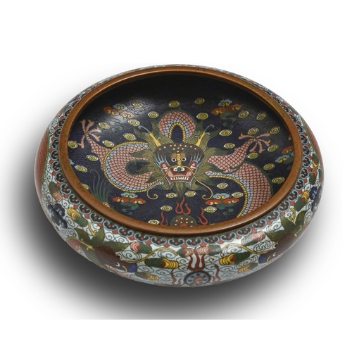 123 - A Chinese cloisonne enamel bowl, early 20th c, the interior with five-claw pink dragon on a deep blu... 