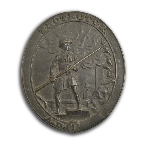 186 - Protector Fire Insurance Company. An oval cast brass fire mark, the design of a firefighter in actio... 