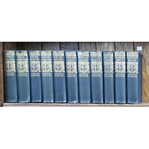 210 - Antiquarian Books. Twenty-six Punch annuals, mid 19th c and later, uniformly bound in red quarter-ro... 