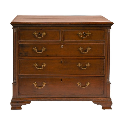 327 - A George III oak chest of drawers, with boarded top, two short and three long drawers, flanked by a ... 