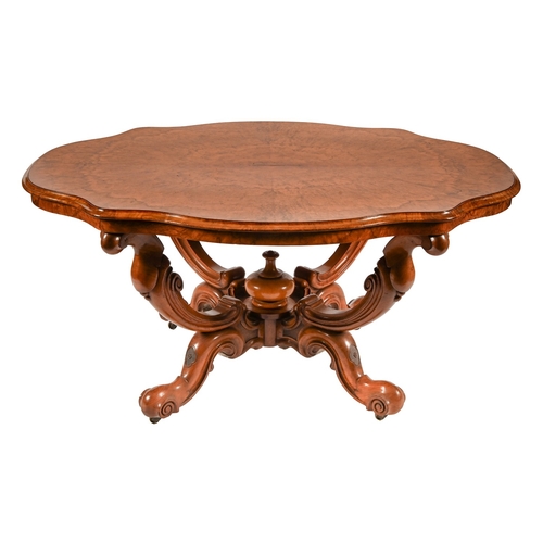 331 - A Victorian quarter veneered walnut centre table, on carved and scrolling quadruple legs, with finia... 