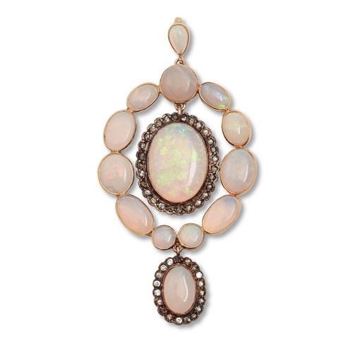 18 - An opal and white stone pendant, in gold, 61mm h, 9.2g