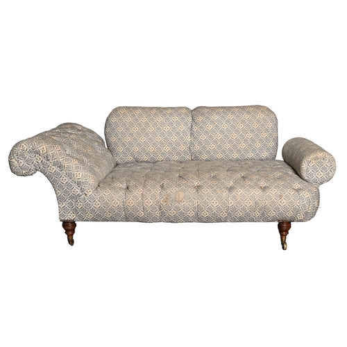 651 - Howard of Berners Street. A late Victorian couch, with scroll and bolster ends, in buttoned and bras... 