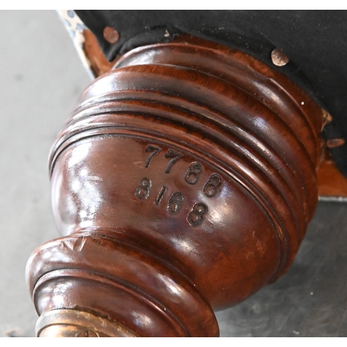 651 - Howard of Berners Street. A late Victorian couch, with scroll and bolster ends, in buttoned and bras... 