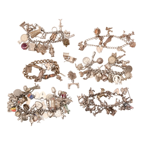 69 - Six silver charm bracelets, with a collection of silver charms, various lengths, 13oz 14dwt... 