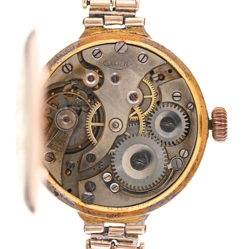 76 - A 9ct gold lady's wristwatch, with enamel dial and Buren movement, 2.8cm diam, import marked, London... 