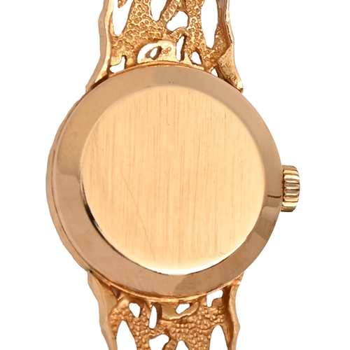 13 - An Omega 9ct gold lady's wristwatch, 1.7cm diam, London 1968, on maker's cast gold openwork bracelet... 
