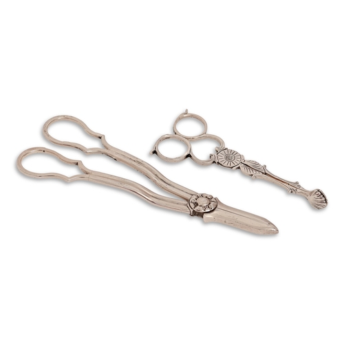 131 - A pair of Edwardian silver grape shears, by Mappin & Webb Ltd, Sheffield 1909 and a pair of silv... 