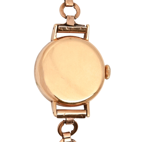 14 - A Movado 9ct gold lady's wristwatch, 2.1cm diam, on a gold circle link bracelet marked 9ct, 17.3g... 