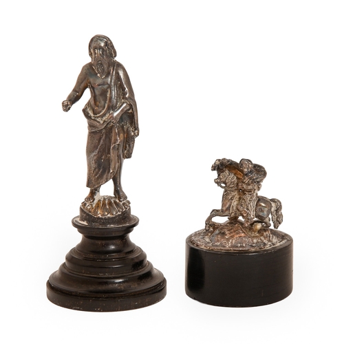 147 - A miniature silvered bronze statuette of St James, 19th c, on turned ebony base, 8.7cm h and a minia... 