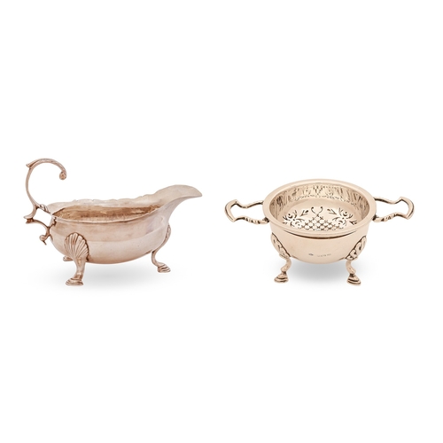 153 - A George II silver sauce boat, on hoof feet, 12cm l, marks rubbed, London 1746 and a silver tea stra... 
