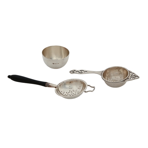 187 - An Elizabeth II silver tea strainer and stand, with ebony handle, maker L P, London 1964 and another... 