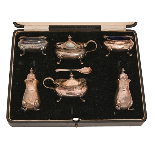 214 - A George V silver condiment set, blue glass liners, pepperette 7cm h, maker R R, London 1932 and 193... 