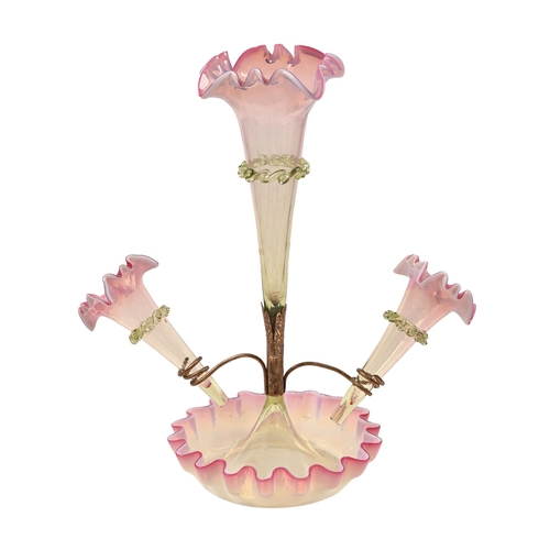 284 - A Victorian semi-opalescent cranberry glass flower stand, of one central and two detachable vases, w... 