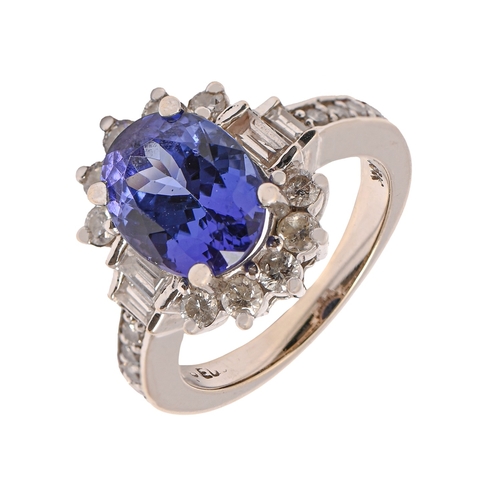 36 - A tanzanite and diamond ring, in white gold marked 18k, 6.1g, size I