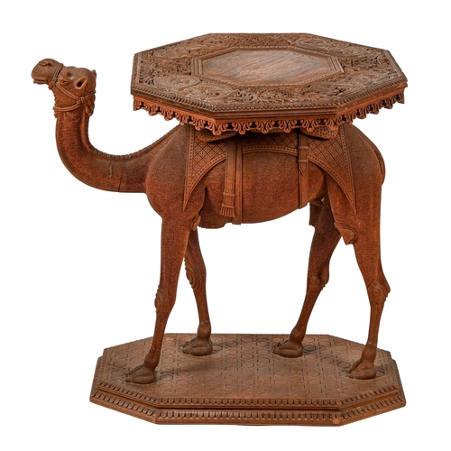 415 - An Anglo-Indian carved teak occasional table in the form of a camel, early 20th c, with octagonal to... 