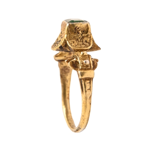 43A - A Spanish emerald and silver gilt finger ring, 16th c, the cut cornered and step cut emerald in a qu... 