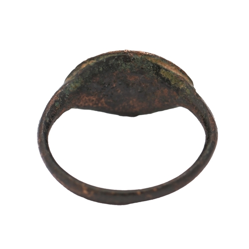 45 - Classical antiquities. A Grecian bronze intaglio ring, 4th c BC, engraved with Nike with garland, si... 