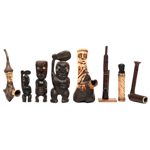 535 - Tribal art. A West African carved bone ceremonial figural pipe, first half 20th c, 20cm h, another o... 