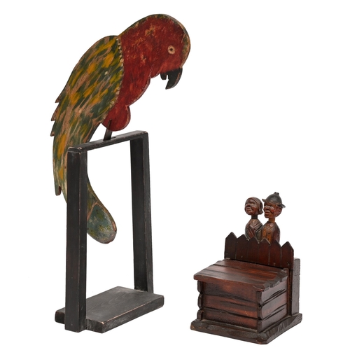 541 - Folk art. A painted and stained wood swinging parrot eyecatcher, early 20th c, 40cm h including stan... 
