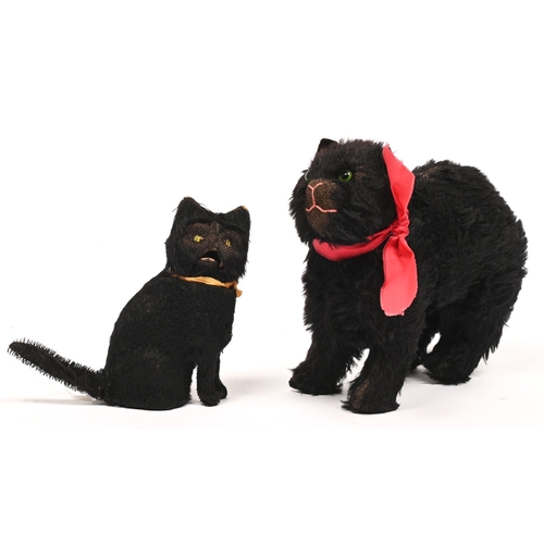 542 - Vintage toys. A clockwork seated black cat, c1930s, 16cm h, and a contemporary stuffed mohair black ... 