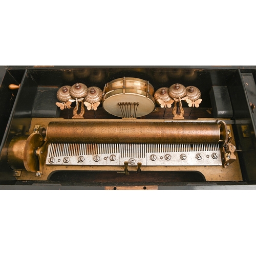 559 - A Swiss cylinder musical box, late 19th c, with bells and drums in sight and rare insect hammers, or... 