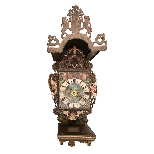 573 - A Dutch Stoelklok, c. late 18th c, with painted dial and cast and painted Putto mask appliques and c... 