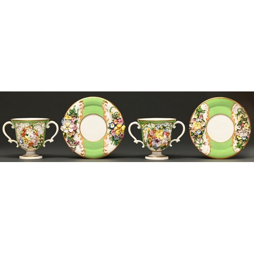 102 - A pair of Bloor Derby bell shaped cabinet cups and stands, c1830, encrusted with flowers, apple gree... 