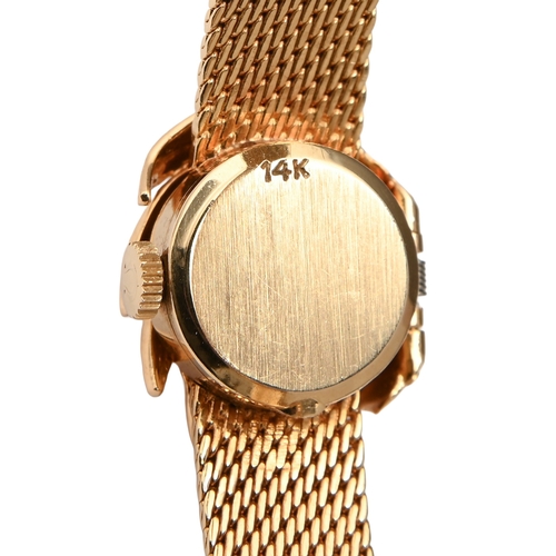 547 - An Omega diamond palm leaf-enclosed lady's wristwatch, in gold, 1.4cm diam, marked 14K, on maker's g... 