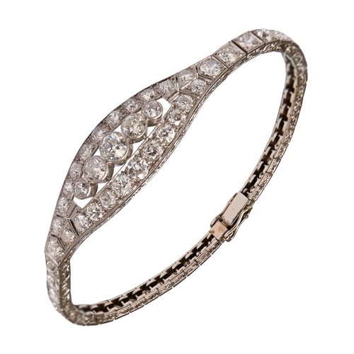 553 - A diamond bracelet, c1940, in platinum and fully articulated, 17cm l, the diamonds estimated to weig... 
