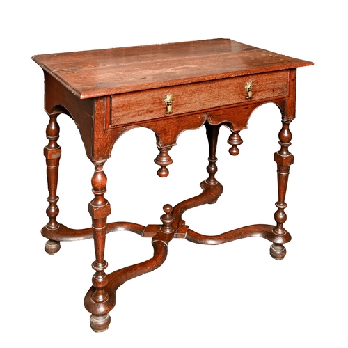 680 - A William III oak side table, two plank top on turned legs and stretcher base, 78cm h; 84 x 50cm... 