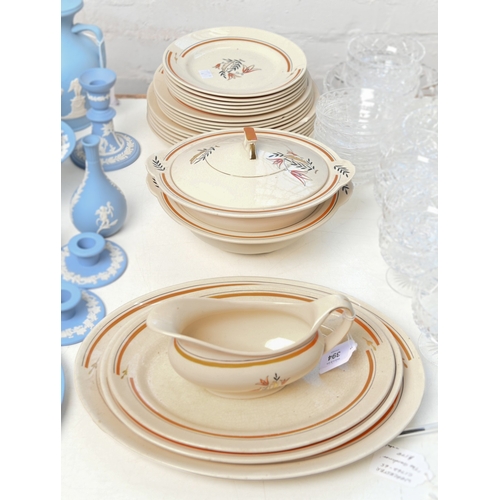 80 - An  H & K Tunstall art deco earthenware dinner service, c1930, meat dish 34cm w, printed mark (2... 