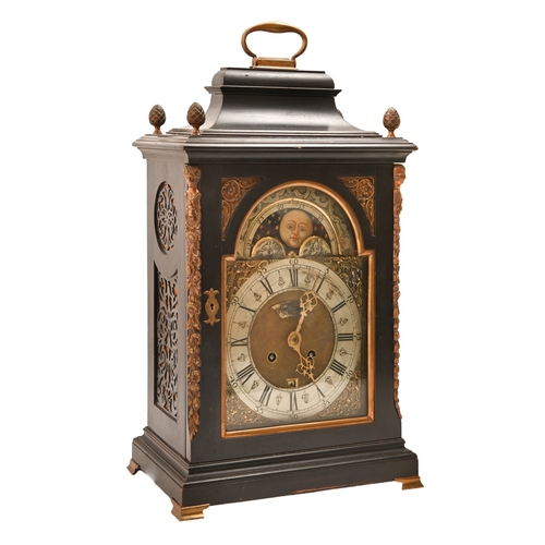 148 - An ebonised bracket clock, in 18th c English style, the breakarched and silvered dial with date aper... 