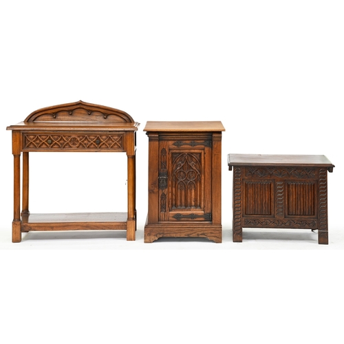 384 - A gothic oak side table and pedestal-cupboard, late 20th c, cupboard with traceried door panel and i... 