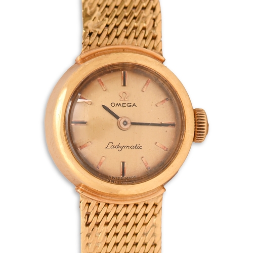 26 - An Omega 18ct gold wristwatch, Ladymatic, 1.8cm diam, on maker's 18ct gold tapered bracelet, 30g... 