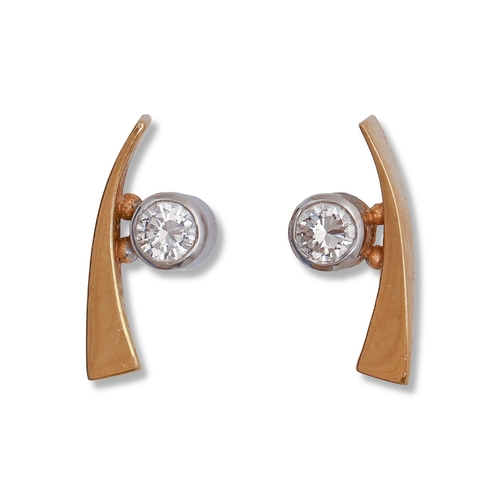 39 - A pair of diamond ear studs, each with a single collet, in two colour 18ct gold, 1.4cm l (collet 0.4... 