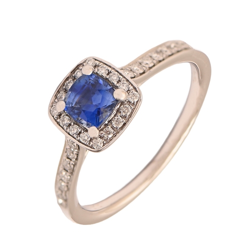 6 - A sapphire and diamond ring, the cushion shaped cluster with larger cushion shaped sapphire between ... 