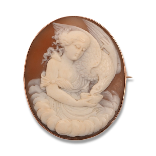 64 - A cameo brooch, late 19th c, the oval shell carved with Hebe and the eagle of Jupiter, in gold, oval... 