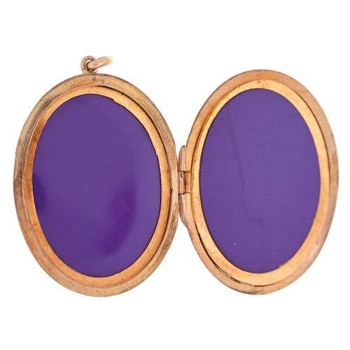 22 - A 9ct gold locket, engraved with leafy scrolls, 5.4cm, Birmingham 1974, 12g