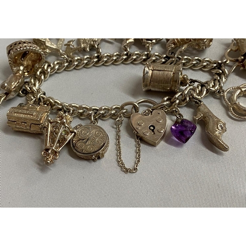 10 - Vintage silver bracelet with patented padlock with 15 rare charms Birmingham 1976 76g