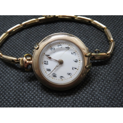 191 - Lady's 9ct pocket watch with extending gold plated wristwatch clasp to turn from pocket watch into w... 