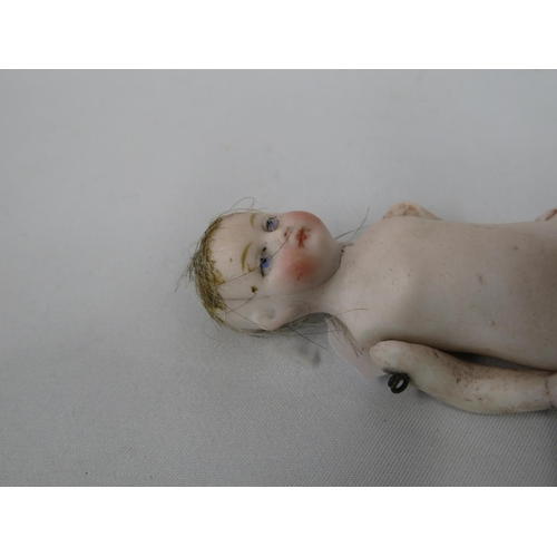 215 - Porcelain baby doll with articulated arms - Victorian - slight damage to head and toe