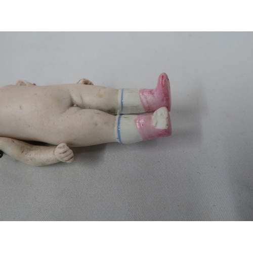 215 - Porcelain baby doll with articulated arms - Victorian - slight damage to head and toe