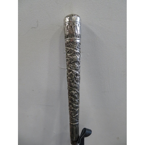 255 - Large silver handled Burmese parasol